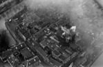 De nog nasmeulende kerk van boven.
              <br/>
              www.geheugenvannederland.nl, 1968